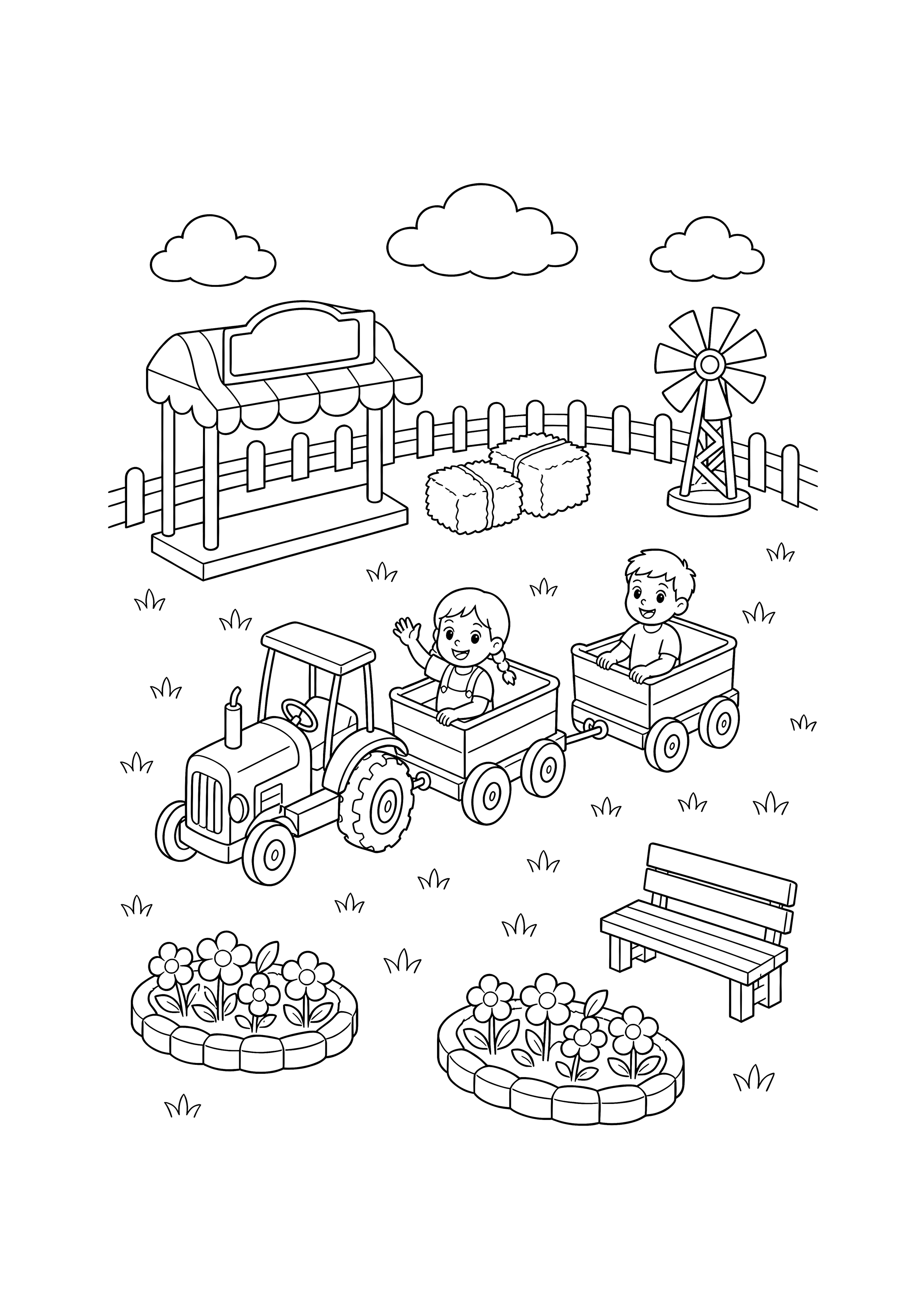 Mini-Traktorfahrt auf der Kirmes — Ein kleiner Traktor zieht zwei Kinderwagen auf einer ovalen Schiene zwischen Heuballen, Windrad, Bank und Blumen.